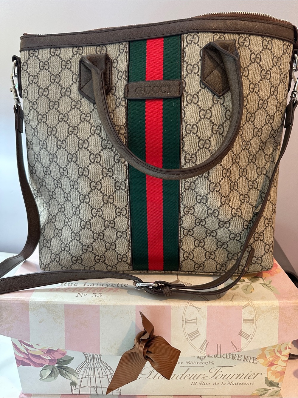 Monogram brown tote with long strap included. Never used!